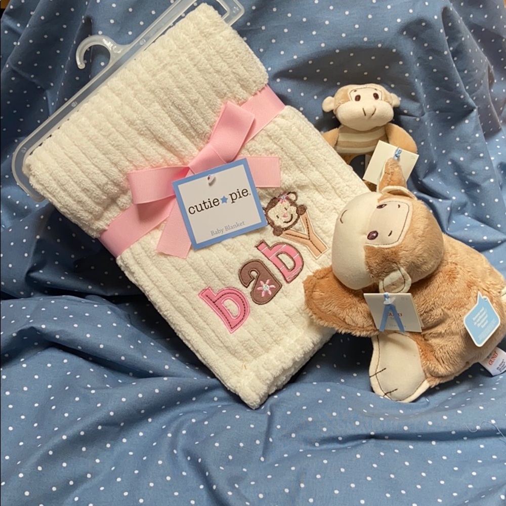 Baby blanket, rattle and teether.
